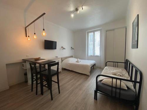 Postel nebo postele na pokoji v ubytování Appartements Foch
