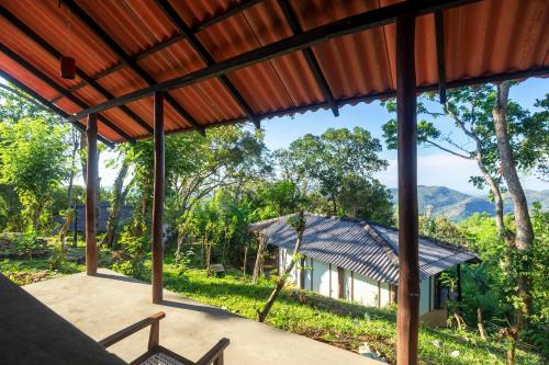 a view from the porch of a house at The Woods in Haputale