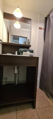 a bathroom with a sink and a mirror at B201 Studio 10 min DisneyLand Paris in Montévrain