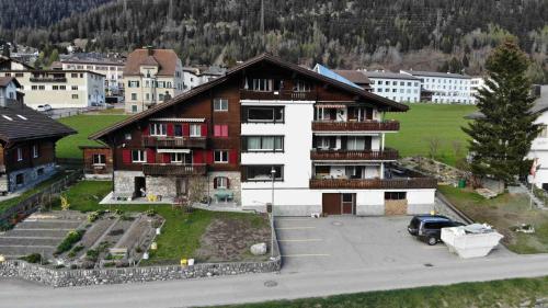 a large building in the middle of a city at Chalet Rezia in Savognin