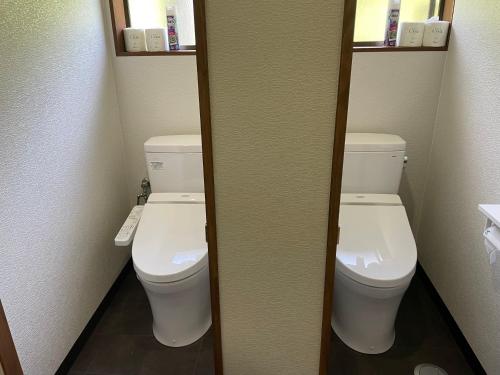 a bathroom with two toilets in a room at K・Lodge in Yuzawa