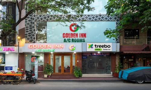 un edificio con un cartello che legge garden inn mg homes di Treebo Trend Golden Inn 700 Mtrs From Promenade Beach a Pondicherry