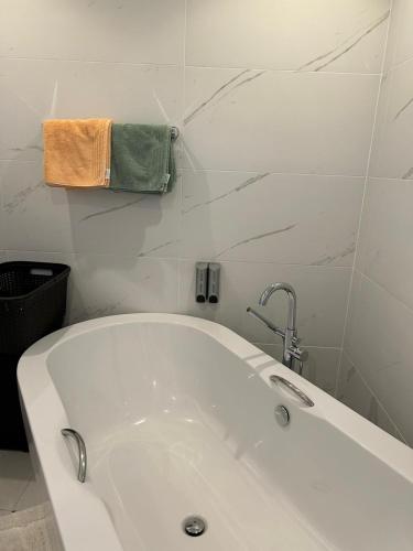 a white bath tub in a white bathroom at Villa Antunovic in Malinska