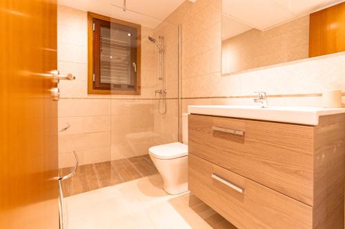 a bathroom with a sink and a toilet at Beautiful Villa Bohemia Ibiza in Sant Josep de Sa Talaia