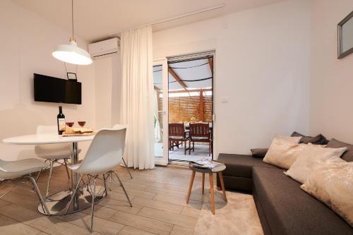 a living room with a couch and a table at Apartment Boris in Trogir