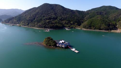 an island in the middle of a large body of water at Tennenonsen Amuri in Amakusa