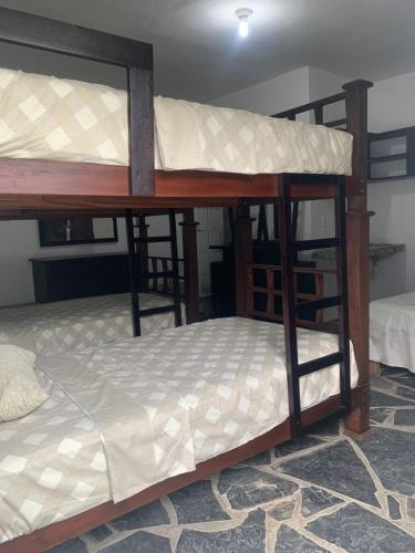 a couple of bunk beds in a room at Hotel/Hostal Casa Blanca in Aquismón