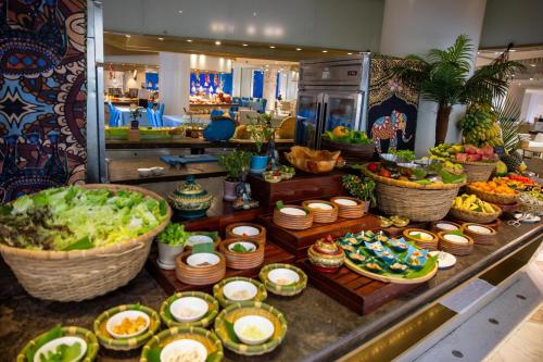 a buffet with many different types of food on a counter at Palace Resort Villas Yalong Bay Sanya in Sanya