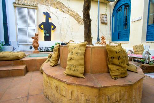 a group of pillows sitting on top of a table at Apartamentos Sharis in Jerez de la Frontera