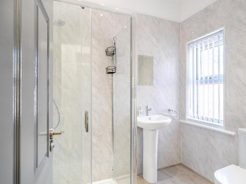 a bathroom with a shower and a sink at Three - Uk43701 in Saint Annes on the Sea