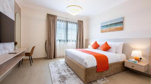 Кровать или кровати в номере GOODWOOD SUITES HOMES VACATION