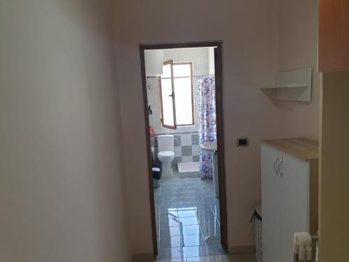 a bathroom with a toilet and a sink in a room at Jozi Kaiser Apartment 3 in Durrës