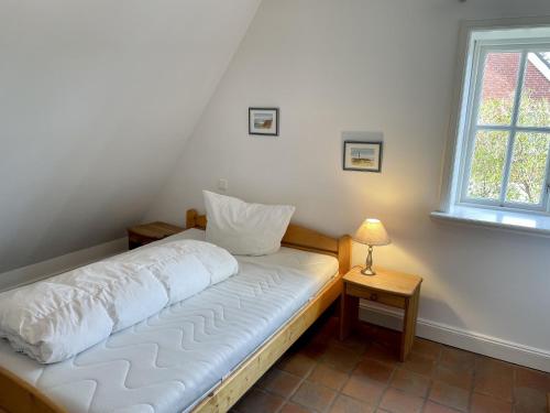 Una cama o camas en una habitación de Min Hüs OG