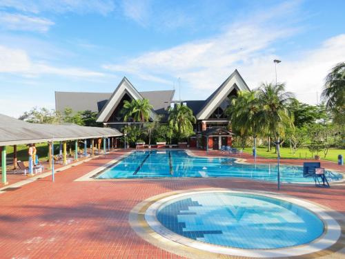 a large swimming pool in front of a building at SouthLinks Country Club in Nagoya