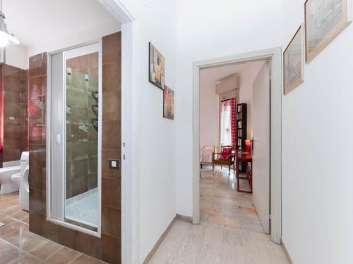 a hallway with a door leading to a living room at Flaminia Bright & Roomy Apartment in Pesaro