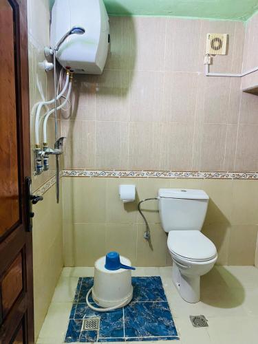 a bathroom with a toilet in a room at Motel Ain Mersa in Ifrane