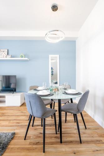 a dining room with a table and chairs at RAKvista Beach Residence- Marjan Island in Ras al Khaimah