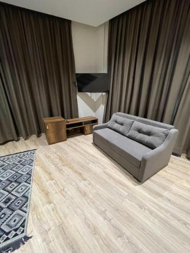 a living room with a couch and a table at Hotel Kroi near castle entrance castle and town view in Krujë