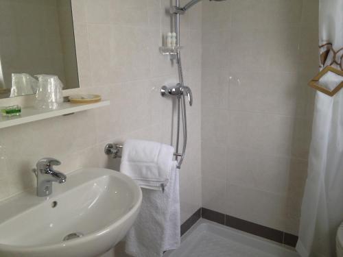 a bathroom with a sink and a shower at Garni Villa Betty in Merano
