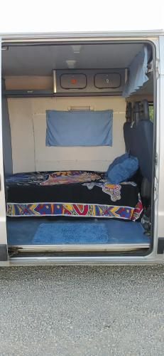 a van with two beds in the back of it at Casa movil in Santa Gertrudis de Fruitera