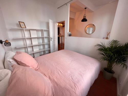 Кровать или кровати в номере Le Panier de Blanche