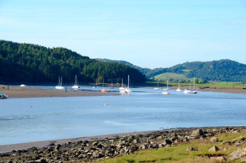 a group of boats in a body of water at Beautiful 4BR Period Home With Spectacular Views in Kippford