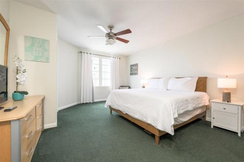 a bedroom with a bed and a ceiling fan at Unit 2432 Ocean Walk - 2 Bedroom Ocean View in Daytona Beach