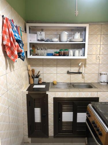 a kitchen with a sink and a counter top at Appart F2 plein centre in Klétigan