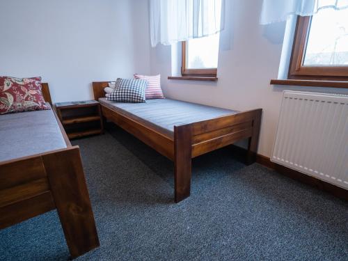 מיטה או מיטות בחדר ב-Zajazd w Biskupinie