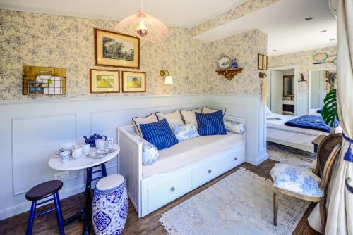 En eller flere senge i et værelse på Tennis Club House