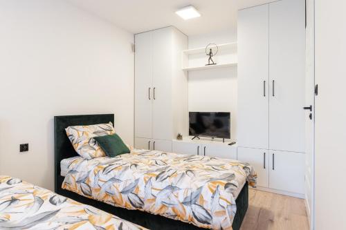 Ένα ή περισσότερα κρεβάτια σε δωμάτιο στο 2 apartamenty typu premium tylko 9 minut do Jeziora Tarnobrzeskiego oraz 15 minut od Sandomierza !!!