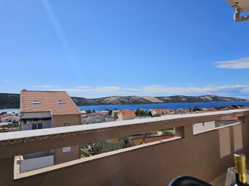a view of the ocean from a balcony at Apartments Cimbal in Stara Novalja