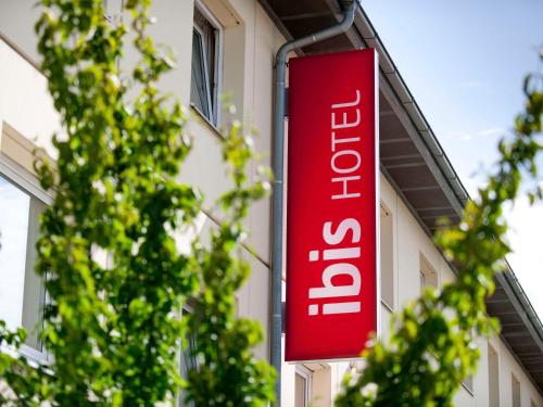 a red sign on the side of a building at ibis Köln Frechen in Cologne