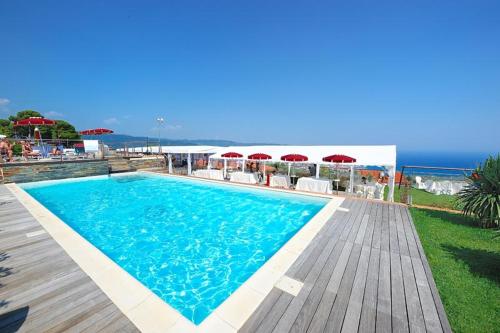 a swimming pool with a view of the ocean at Poggio dei Gorleri in Diano Marina