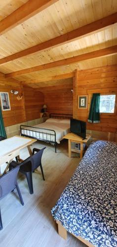 a room with two beds in a log cabin at Casa di Pier e Nanni by Salento com in Gallipoli