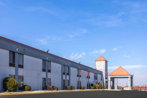 a large building with a clock tower in front of it at Baymont by Wyndham La Vergne Nashville I-24 East in La Vergne