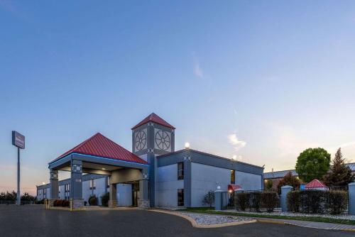 a building with a clock tower on top of it at Baymont by Wyndham La Vergne Nashville I-24 East in La Vergne