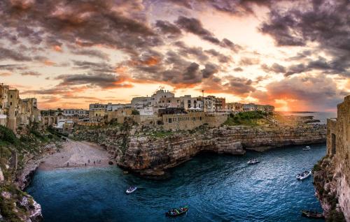 a view of a city with boats in the water at Dimora Donna Matilde in Polignano a Mare