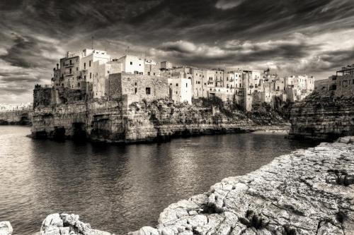 a black and white photo of a city with buildings at MC Suite Relax in Polignano a Mare