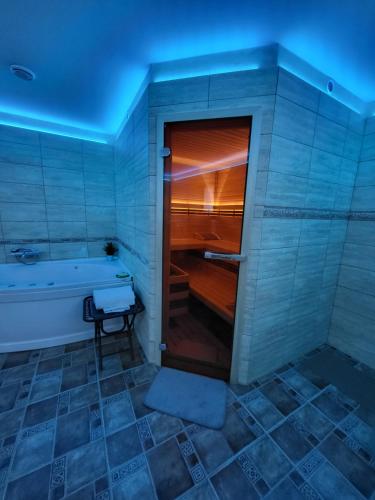 a bathroom with a bath tub and a tub at Penzion Ostravanka in Hranice