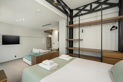 Katil atau katil-katil dalam bilik di Ostrakon Suites