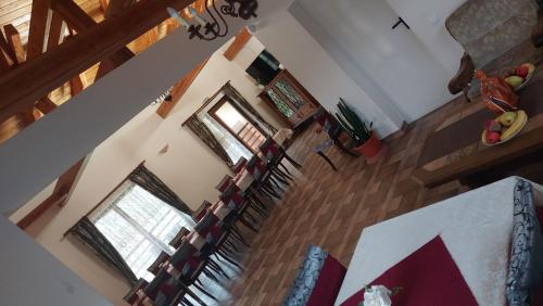 an aerial view of a living room with a living room at Pensiunea Romosan in Cucuiş