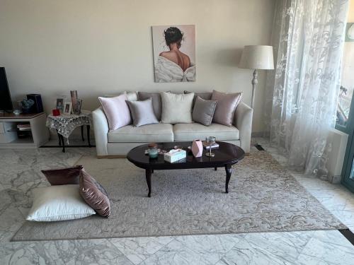 a living room with a couch and a coffee table at Luxurious Grand plaza in Alexandria