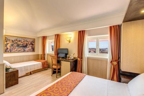 a hotel room with two beds and a desk at Pinewood Hotel Rome in Rome