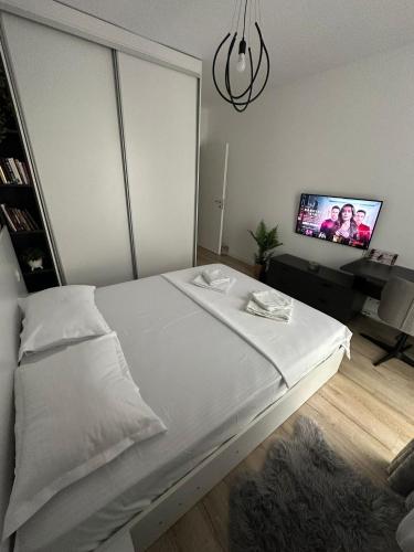 Postel nebo postele na pokoji v ubytování Citta luxury apartment 75