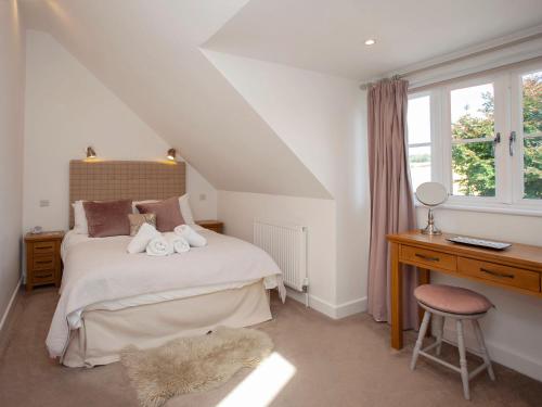 Voodi või voodid majutusasutuse Tokenhill Cottage toas