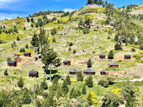 a group of cabins on the side of a mountain at Mountain Eco Shelter 7 in Funchal