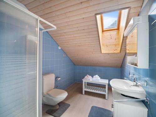 a bathroom with a toilet and a sink and a shower at Casa Cattaneo in Faido