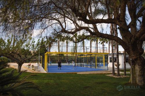 a tennis court in front of a building at B&B Villa Seta in Agrigento