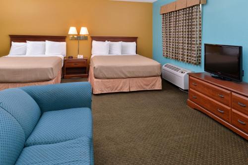 Llit o llits en una habitació de Americas Best Value Inn - Seymour